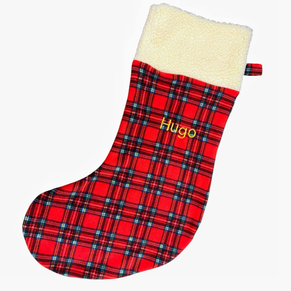 Red tartan Christmas stocking with a cream teddy cuff, embroidered Hugo